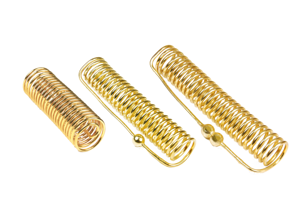 3 different sizes of Acu-Vac Coils on a white background